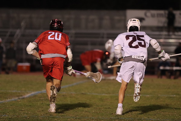 Long-stick midfielder Matthew Nason (25) prepares to assist his teammates in a face-off against Kings Academy. The Eagles would go on to lose the game 12-9.