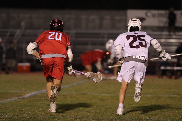 Long-stick midfielder Matthew Nason (25) prepares to assist his teammates in a face-off against King's Academy. The Eagles would go on to lose the game 12-9.