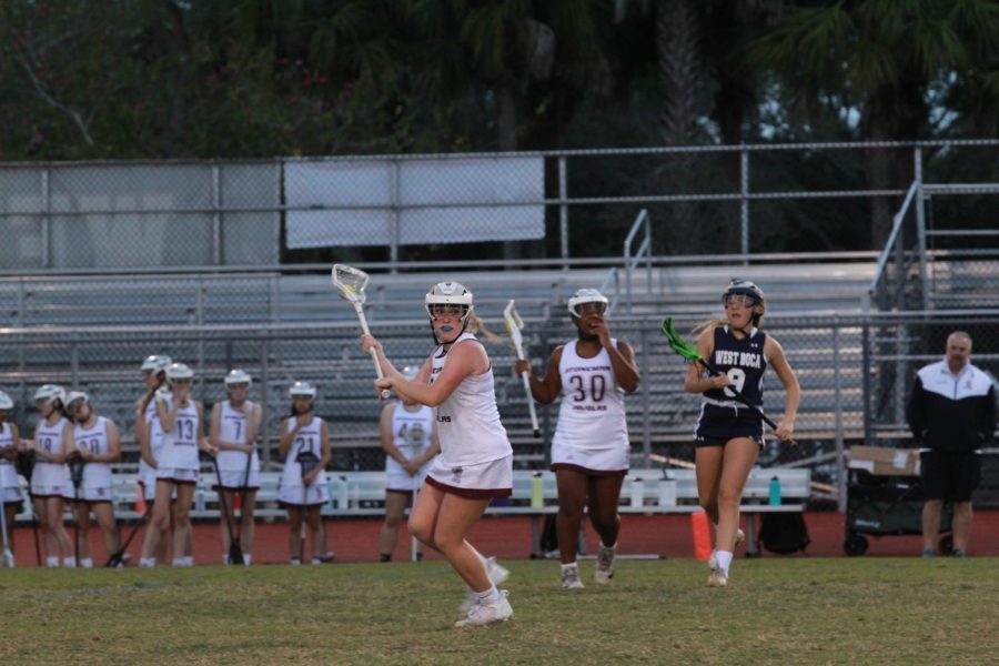 Midfielder Gracyn Haynes (2) prepares to throw the ball towards the opposing goal.