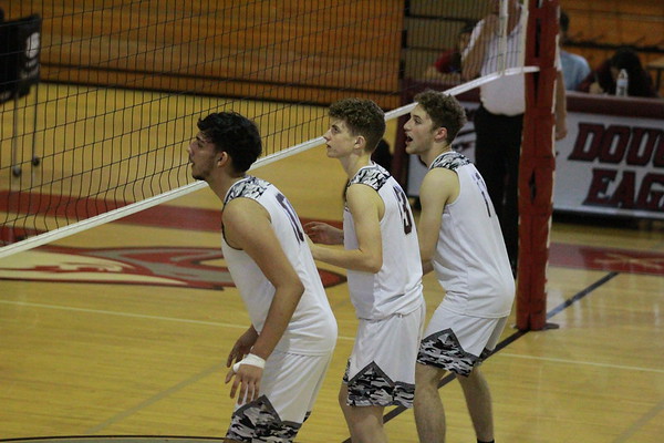 MSD varsity volleyball players set up their defensive line in their second game of the 2021-2022 school year against Charles W. Flanagan High School.