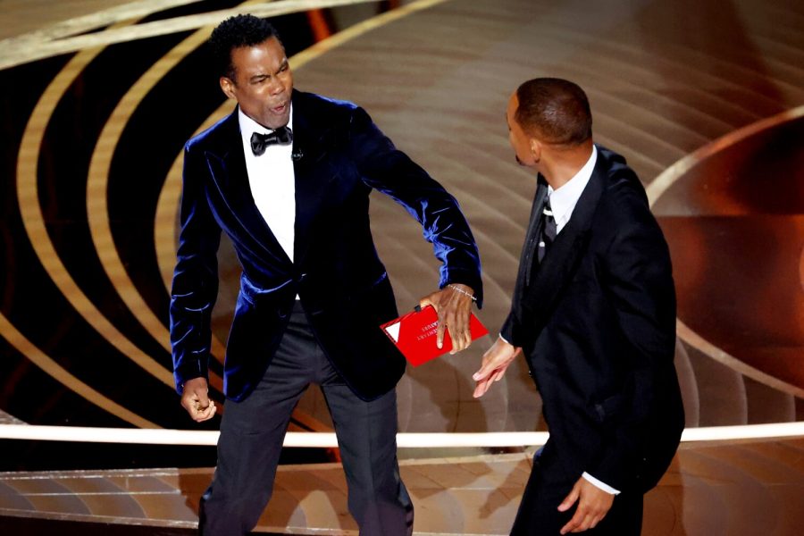 Actor and singer Will Smith slaps comedian Chris Rock at Oscars after he satrically referred to Jada Pinkett Smith as GI Jones. Smith will face undeclared consequences.