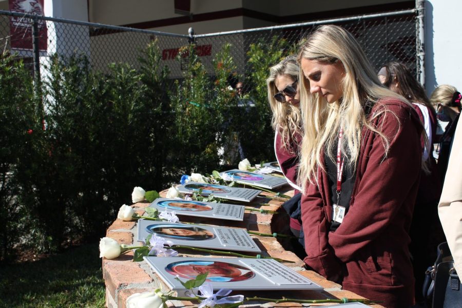 Literacy Coach Gabriela Prochilo reads the plaques in the MSD Remembrance Garden. The garden was unveiled on Feb. 14, 2022, the four year anniversary of the MSD shooting.