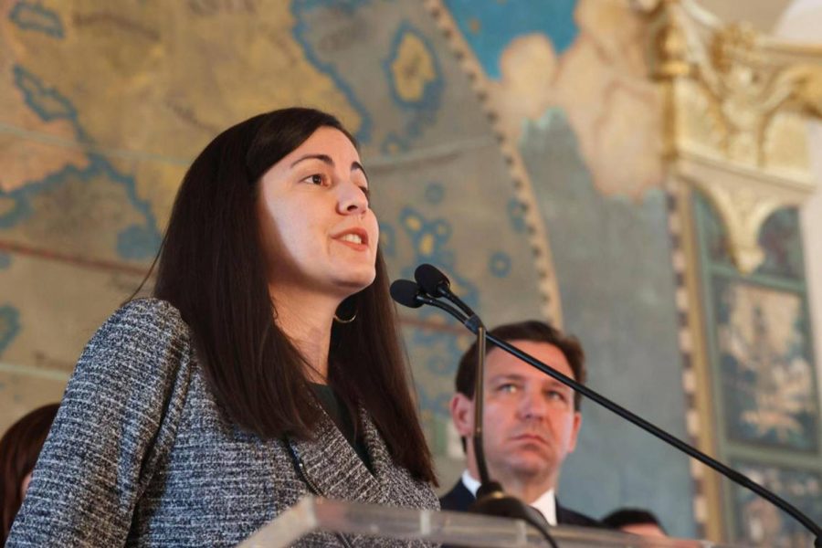 Rosa Maria Paya speaks about her father while Governor Ron DeSantis watches during a Honoring the Victims of Communism press conference at the Freedom Tower in Miami on Monday, May 9, 2022. Paya’s late father, Oswaldo, will have a plaza named after him. DeSantis later signed Senate bill 160 to make this designation. Courtesy of Alie Skowronski/Miami Herald/TNS.