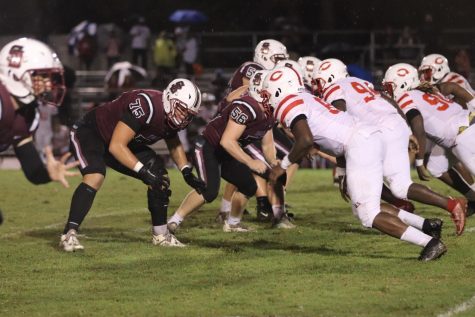Tackle Jeremy Fishkin (75) lines up with the rest of the Eagles defense before the Colonels snap. The Eagles defense held off the Colonels throughout the game; however, it was not enough to prevent the 40-26 loss.