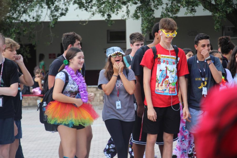 Students watch musical chairs being played in the courtyard while wearing their Wacky Wednesday clothes during spirit week.