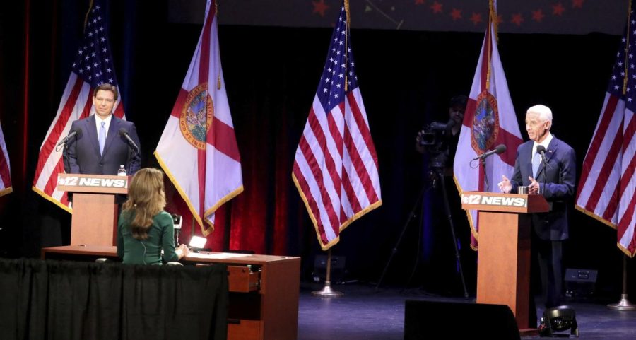 Gov. Ron DeSantis faces Charlie Crist in a Florida gubernatorial debate at the Sunrise Theatre in Fort Pierce on Monday. Photo courtesy of Carline Jean/TNS.