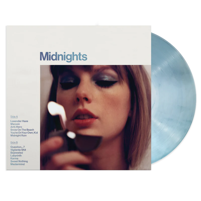 Taylor Swift releases multiple album covers with a collection of multicolored vinyl records. The Moonstone Blue edition, the primary cover, pictures Swift with a lighter and fluorescent blue eye shadow to match the color of the record.