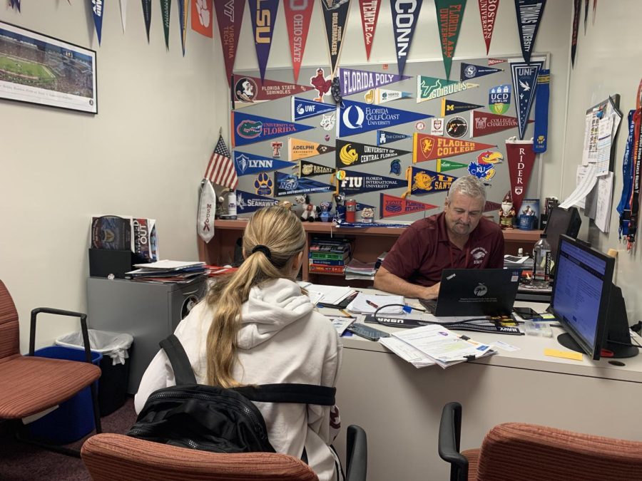 MSD seniors often seek out BRACE Advisor Randy Congdon for any college-related questions and concerns during lunch and study hall. Senior Anabelle Niddam talks to Congdon about applying to state schools before the deadline.
