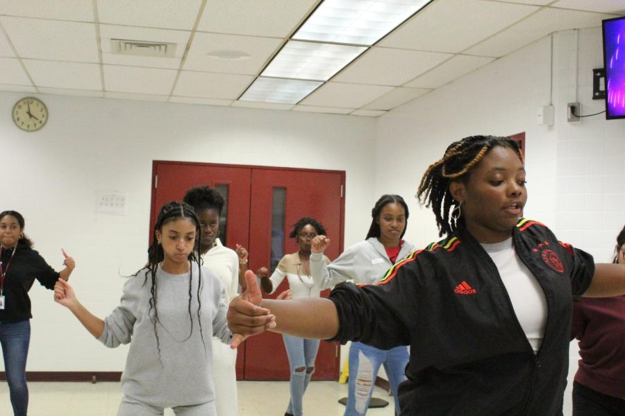 Girls trying out for the Jamaica performances mimic the choreographer, senior Neketa Dixon-Jenkins. She evaluates the final people who will be participating in the Black History Month show.