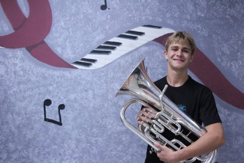 Freshman Gage Heller stands with his euphonium, an instrument he has been playing for four years. Heller is one of five freshman in the Wind Orchestra, the highest level of concert band at MSD.