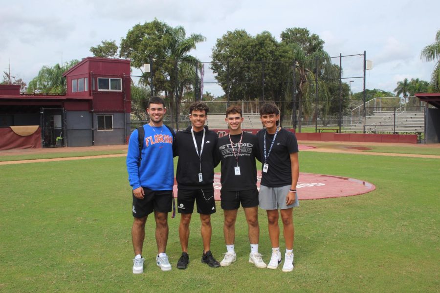 The Rodriguez family stands in front of the mound at Marjory Stoneman Douglas High Schools baseball field. Christian, Angel, Jonathan and Alex are all key members of the MSD baseball team.