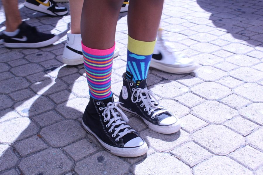 MSD students wear bright and colorful socks with Converse for support of a drug-free world during Red Ribbon Week.