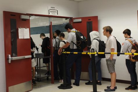 Students wait in line to receive their lunch, which they have to pay for now unless they are approved for free or reduced lunch. Prior to this school year, schools offered free lunch and breakfast due to the COVID-19 pandemic.