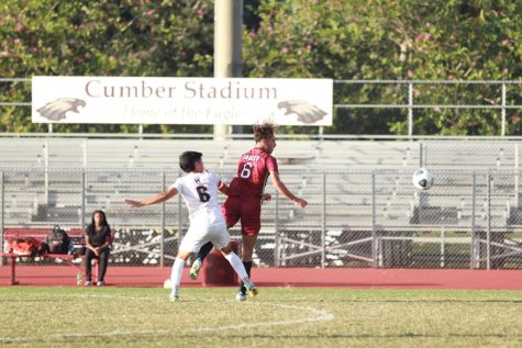 Midfielder Tomer Yair prepares to deflect the incoming soccer ball in a match against Monarch High School, of which the MSD Eagles lost 3-1. Yair committed to Bloomsburg University after a successful run as captain of the MSD varsity soccer team.