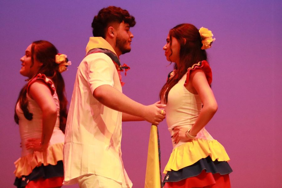 Juan Vargas and Gabriella Vivas move their hips to the sound of the drums from the dance tambores. In the multicultural show, tambores represented Venezuela.