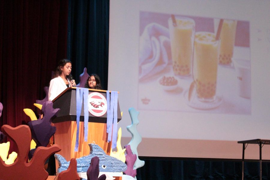 Two contestants present Go Boba, a business that sells boba vending machines. There were eight groups in total that presented their products to the Sharks.