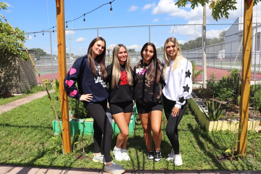 Fashion Show. Students (from left to righ) Junior Eden Rothstein, Sophomore Ayla Sachs, Junior Lauren Buchwald, and Sophomore Savannah Tenore wearing their Splattered Essentials merchandise. Lauren Buchwald started her own business during quarantine in 2020 andhas gained many followers since