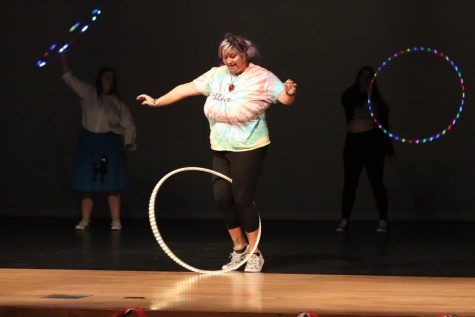 LED Dance Club advisor Chelsea Briggs surprised the audience by performing hula hoop tricks. The stage lights flickered on and off to highlight the light-up prop during her solo stage.