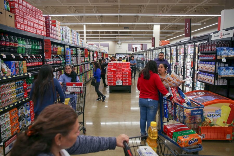 People shop during the Grand Opening of a Smart & Final Extra! at Jordan Downs Plaza, in Watts on January 8, 2020 in Los Angeles, California. The grocery store is providing fresh food in what is currently a USDA-designated food desert, a community in which at least 33 percent of the population resides more than 1 mile from a supermarket or large grocery store. Photo courtesy of Dania Maxwell/Los Angeles Times/TNS.