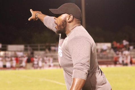 Football coach Powers directs his players at Monarch v. Douglas on Sept. 22, 2022. The Eagles ultimately lost 14-20.