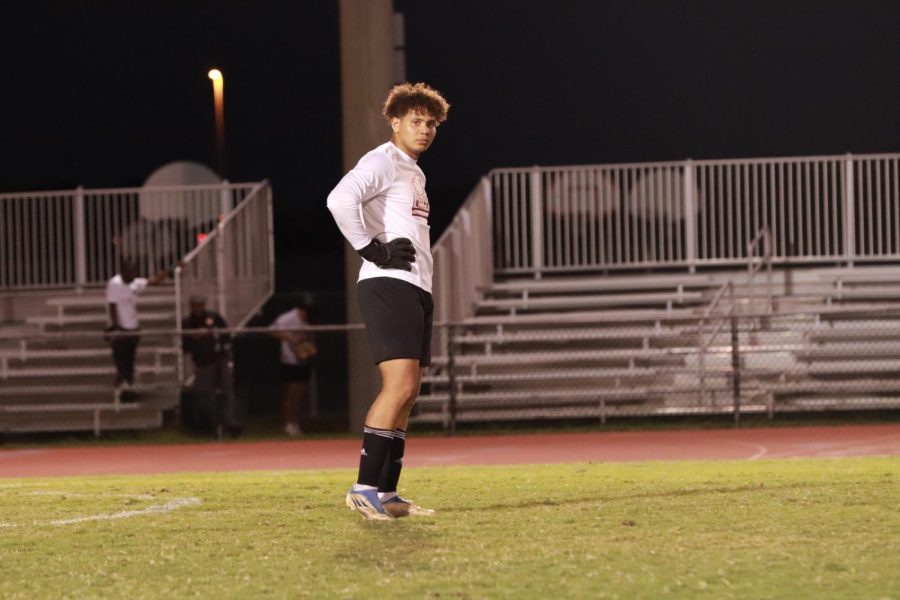 Goalkeeper Victor Batista (1) of the men's varsity soccer team gets ready to cover the goal from the South Plantation Paladins. Batista covered many goals this game, in which the Eagles won 5-0.