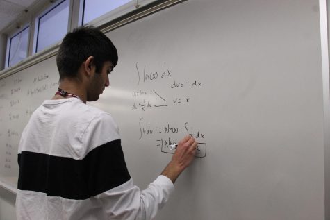 Junior Arya Gujarathi works on math problems during his study hall period in preparation for the math competition season. He was recently chosen as a Sunshine State Scholar for his accomplishments in mathematics and science.