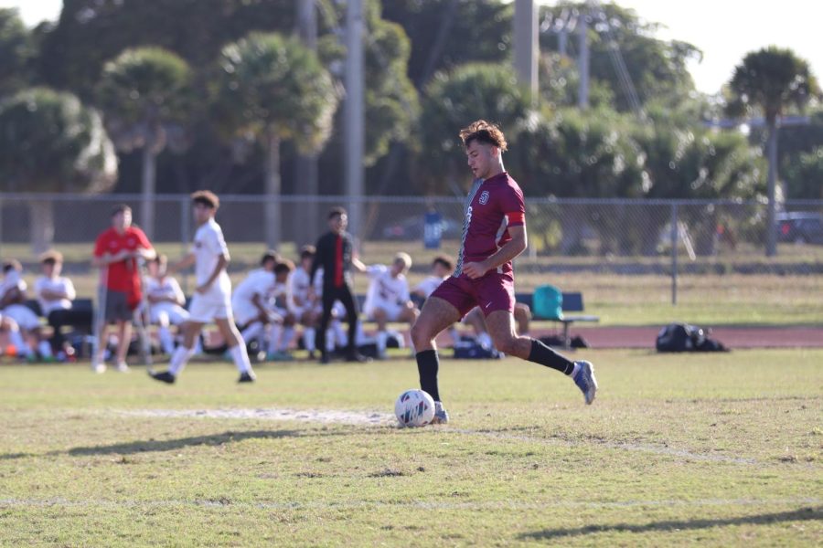 Midfielder Tomer Yair (6) and captain for the Marjory Stoneman Douglas Eagles prepares to kick the ball and pass it to his central defender. The Eagles lost this district round against Monarch High School with a score of 2-0. The Eagles will most likely comeback to the field in the regional playoffs.