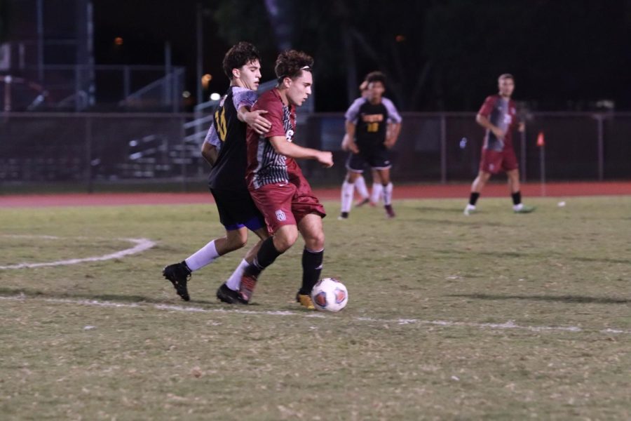 Defender Robbie Alhadeff (8) drives the ball in a match against the South Plantation Paladins. Alhadeff scored one goal in this game, contributing to a 5-0 victory.