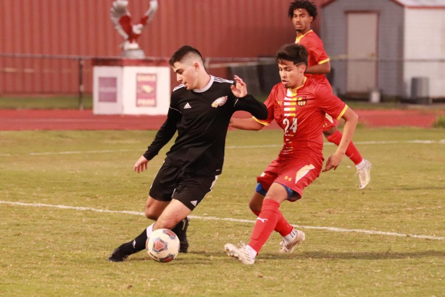 Defender Shadi Buchanan (4) drives the ball. Buchanan highly contributed to this game against South Broward High School. The final score of the game was 1-0, in favor of the Eagles.