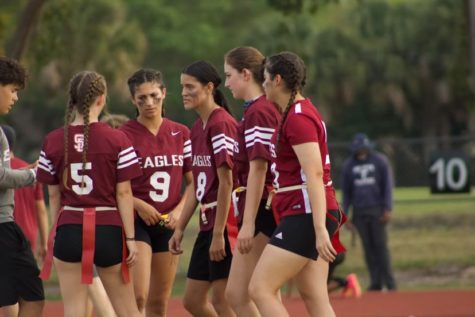 The MSD womens flag football team huddles before their first game of the season. During this huddle captain Mia Beteta (8) gives her teammates advice and motivation before this big game.