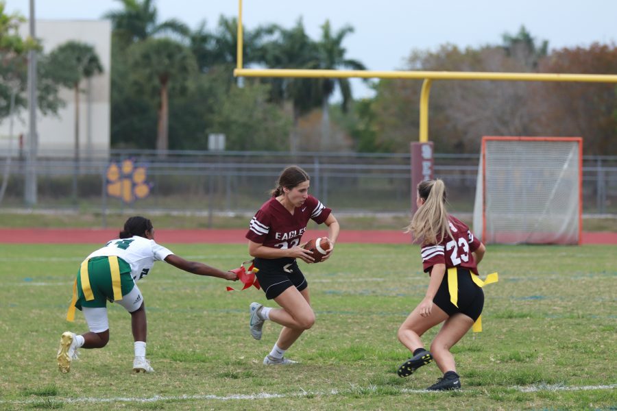 Defensive back Sophia Dal Molin (22) quickly attempts to outrun her opponent as she receives the ball after a long pass from her teammate. The Eagles lost 6-2 to Flanagan High School.