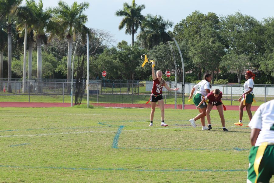 Wide receiver Kenslee Ward (10) snatches her opponents flag as she charges quarterback. She contributed to the Eagles offense during the game against Flanagan High School.