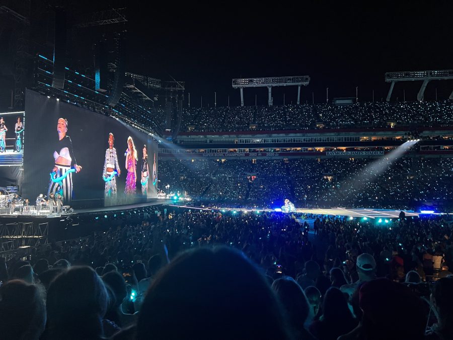 Pop superstar Taylor Swift performs Blank Space during the 1989 portion of Tampa Day 2 of The Eras Tour, which showcases songs from each album. LED bracelets handed out to concert-goers at the entrance illuminate the crowd and change color according to the different songs of each era.