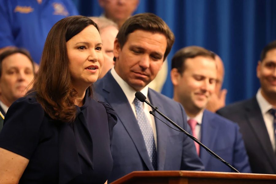 Florida Attorney General Ashley Moody at a 2021 press conference with Gov. Ron DeSantis. Photo permission from Ricardo Ramirez Buxeda/Orlando Sentinel/TNS.