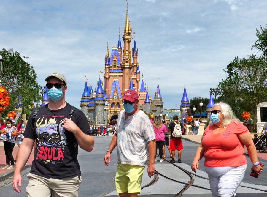 Guests walk on Main Street, U.S.A., in front of Cinderella Castle in the Magic Kingdom at Walt Disney World on Sept. 30, 2020. Photo permission from Joe Burbank/Orlando Sentinel/TNS.