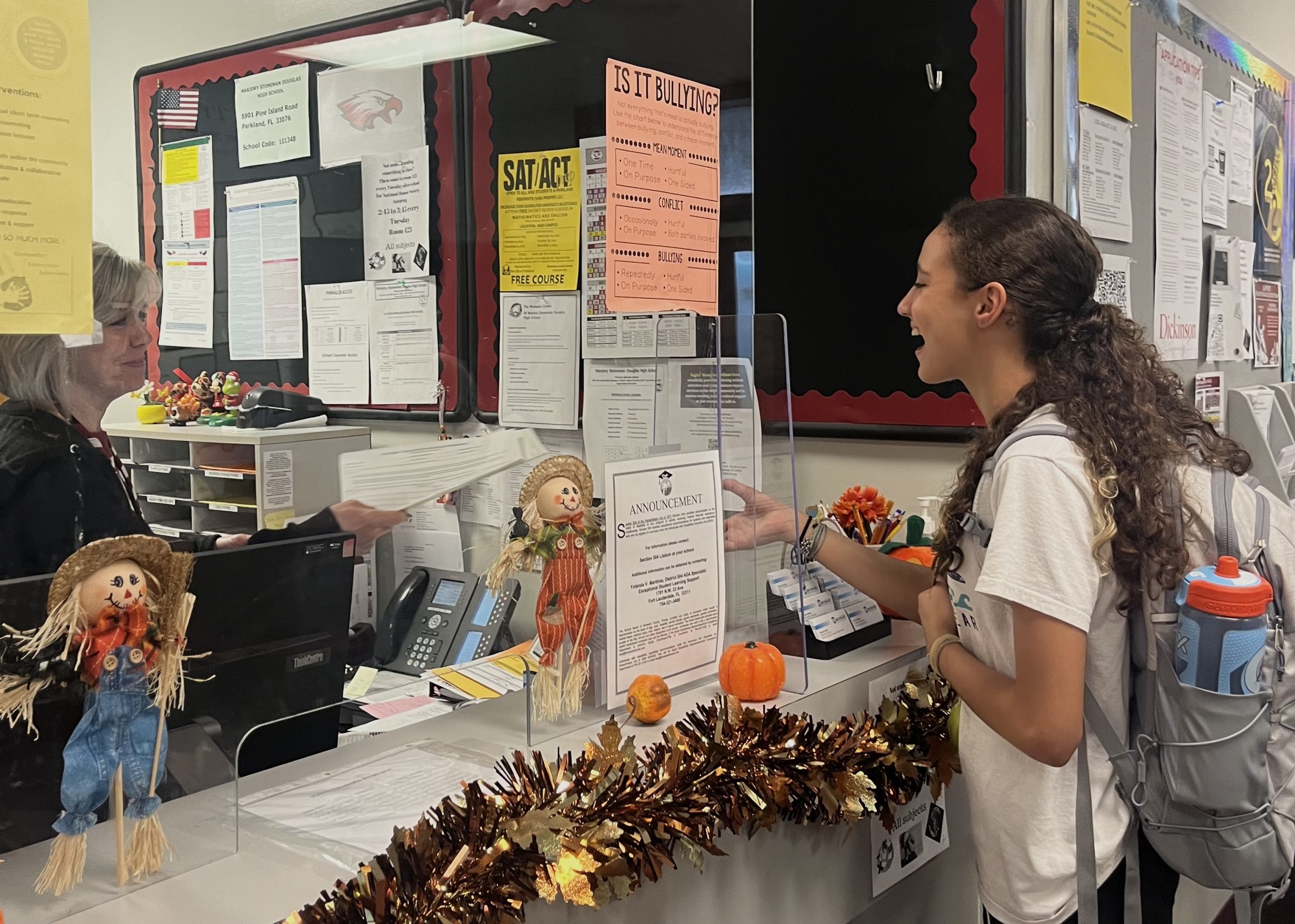 A MSD student drops off service hours sheet to guidance staff member. Due to this years new Broward County rules, Marjory Stoneman Douglas is being more strict on what activities they allow community service hours to.
