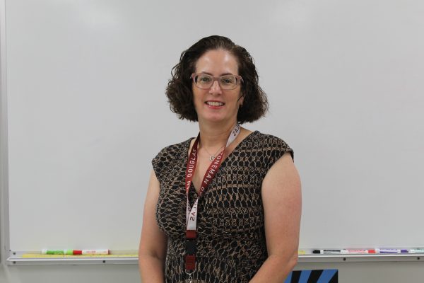 New algebra teacher Rosemary Cernech stands by her white board, ready to teach. Cernech has been teaching math for 12 years between Texas and in Florida and is excited for the new school year.