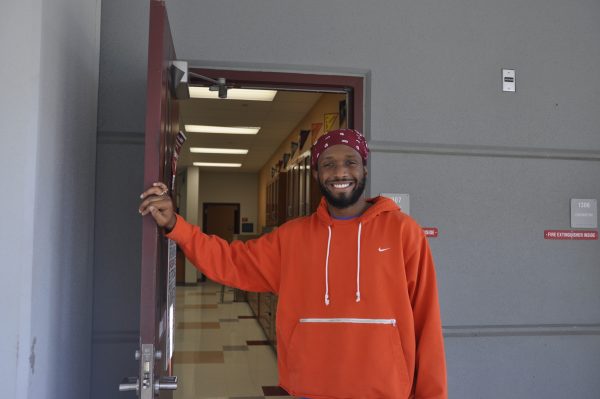 New science teacher Bryce Robinson-Burgess holds the door open for incoming students. Coming from Silver Lakes Middle School, Burgess has now found a place for himself at MSD, where he has found students and staff to be extremely inclusive and welcoming.