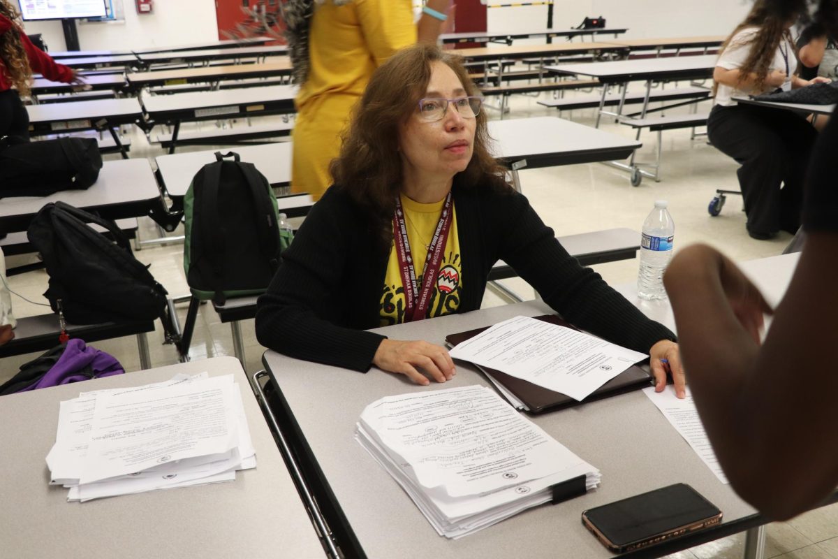 Form A Line. Spanish Club sponsor Maria Garcia collects after school authorization forms for the annual Multicultural show tryouts. The forms had to be signed by each student’s guardian and were turned in by every dancer who stayed after school the week of Sept. 11-15.