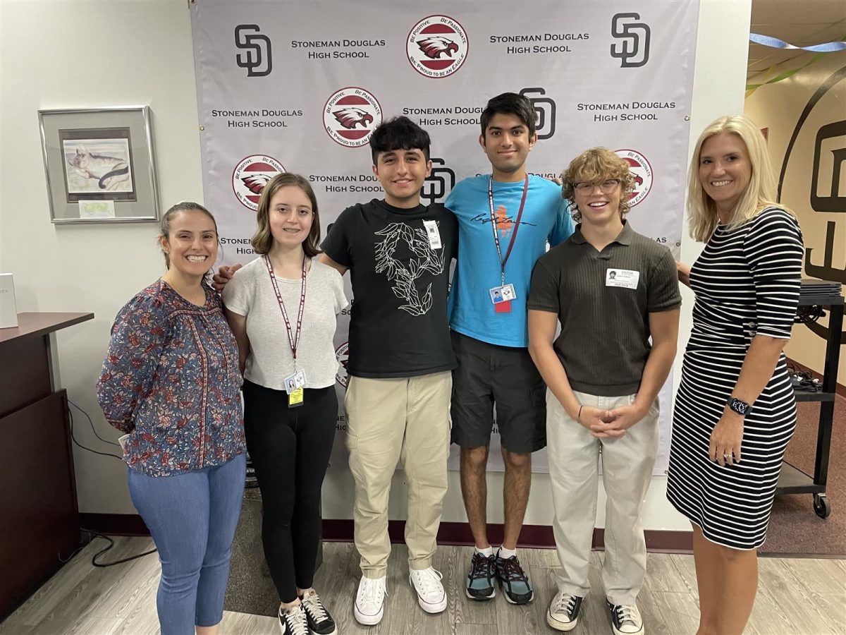 Seniors Piper Bourne, Serkan Aymaz, Arya Gujarathi and Caleb Hebert pose with Principal Michelle Kefford and Head Guidance Counselor Veronica Melei. The four seniors were announced to be MSDs National Merit Semifinalists, based on their PSAT scores from October of their junior year.