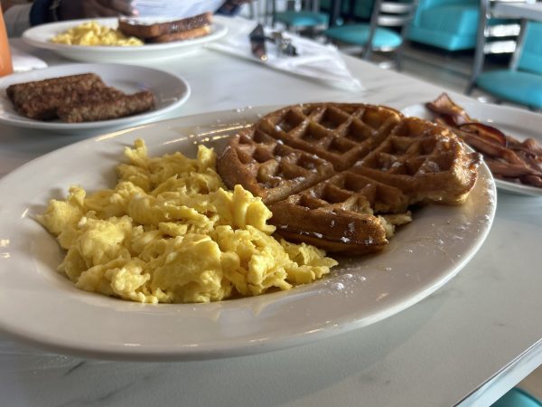 At Addiction Bistro, the waffle and eggs meal had hints of vanilla on the waffle and the perfect amount of salt on the eggs. The meal costs $14.99 and includes the eggs and three strips of bacon.