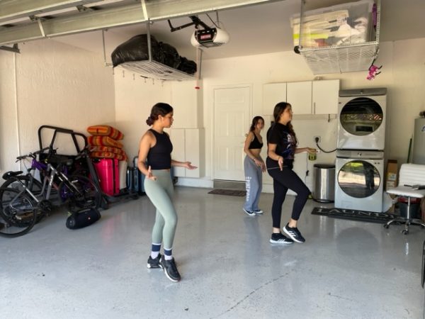 Practicing for the Multicultural Show, junior Carolina Ochoa teaches the choreography of a Columbian dance to junior Laly Cruz and senior Elle Bouzaglou. The Multicultural Show is performed annually, and to prepare for it, students have begun practicing months in advance.