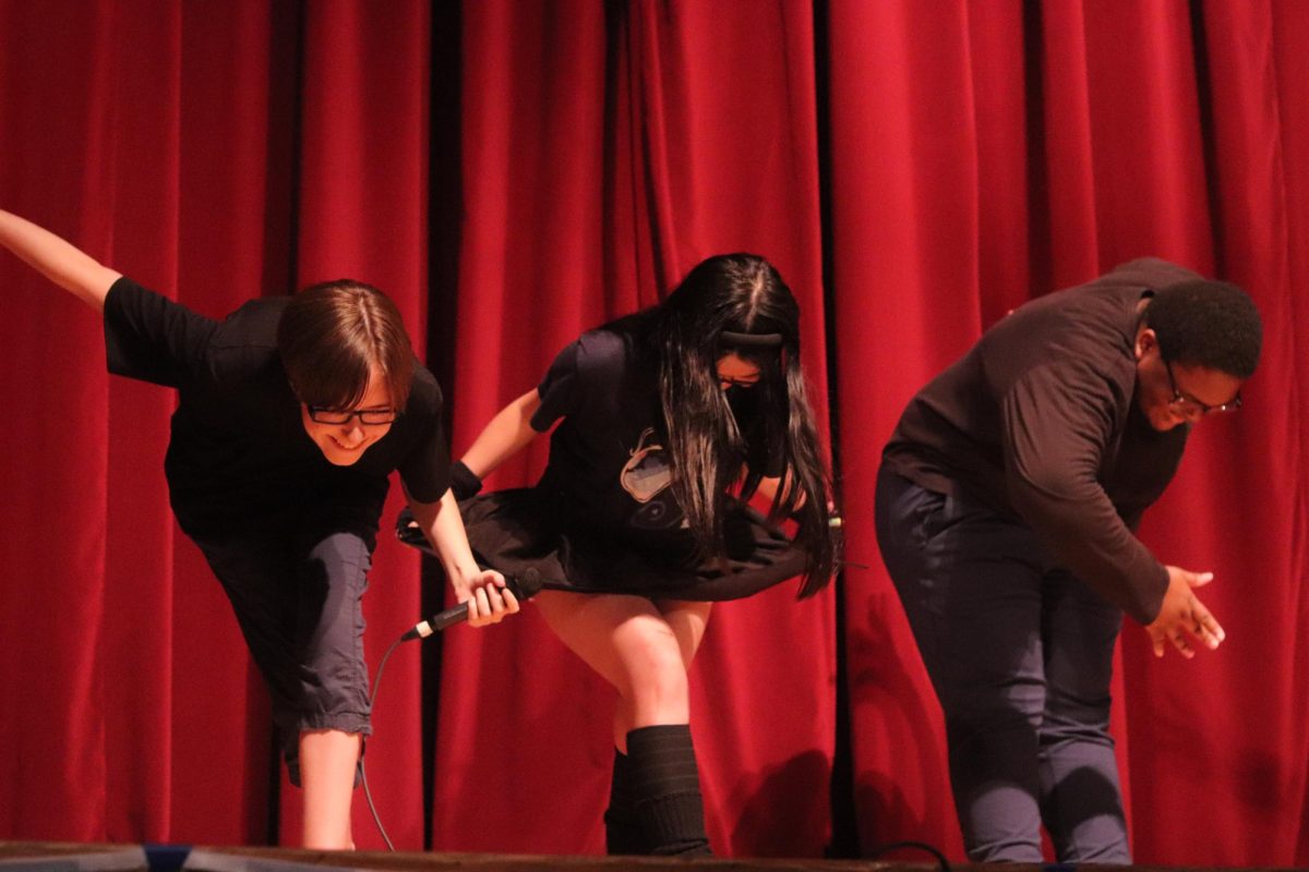 Beginning Bows. Seniors Chris Salazar, Lily Fang, and Jaison Harvey take a bow after performing their Spoken Word poems. The poems represented cultural stereotypes and overcoming them by appreciating cultures around the world. 