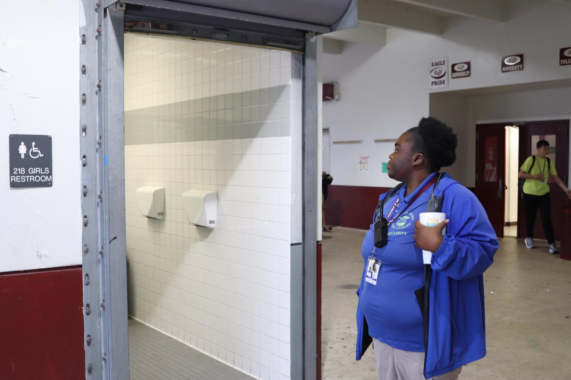 On the Job. As part of her duties as Campus Monitor Michelle Smith checks the girls’ restroom before school begins. Smith’s responsibilities include frequent bathroom checks to ensure students are respecting school rules. “Overall, I just make sure everyone on campus is safe,” Smith said. 