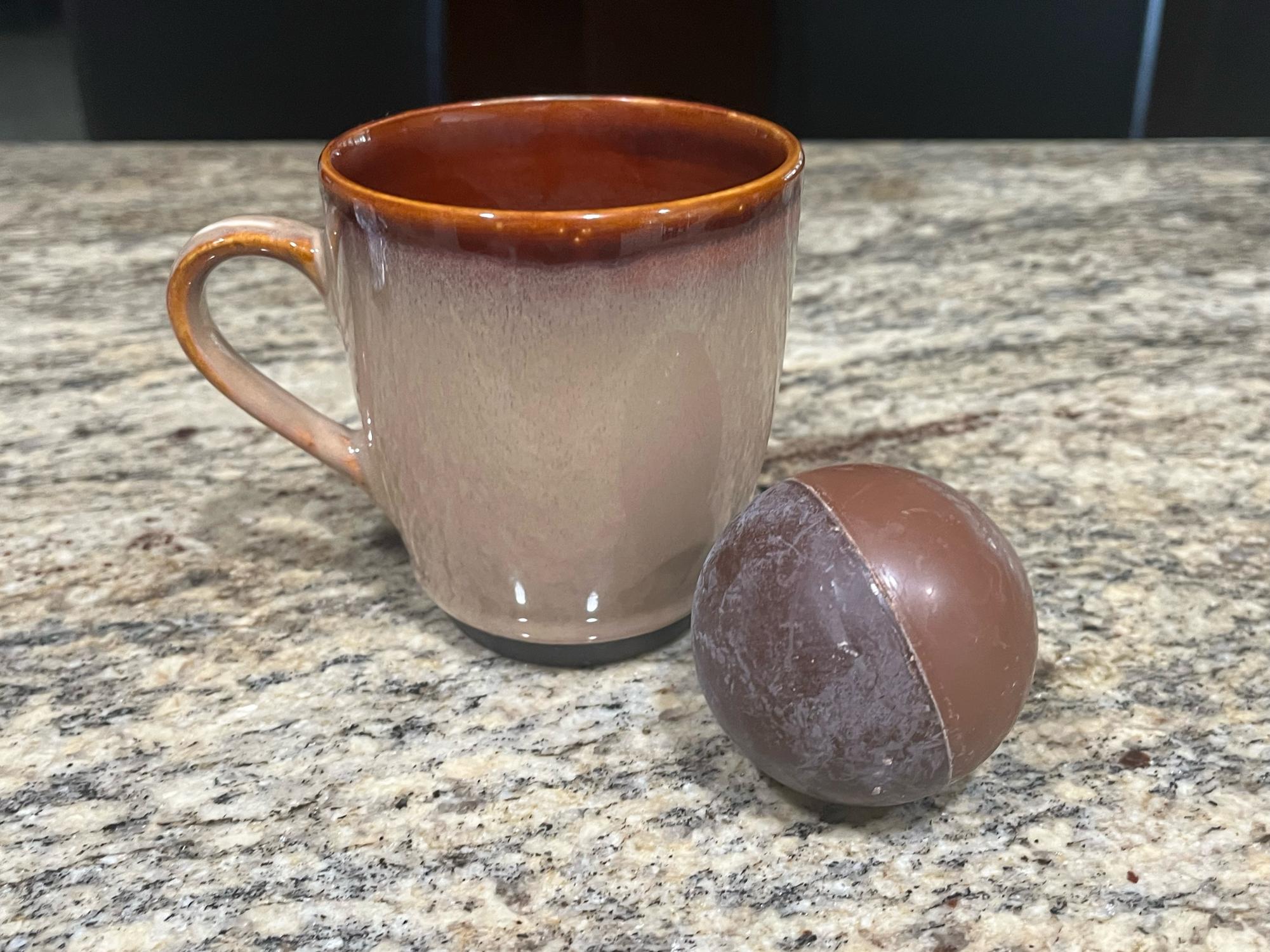 Homemade hot chocolate bombs offer a delicious way to celebrate the holiday season. When placed in warm milk, the bombs melt to create hot chocolate.