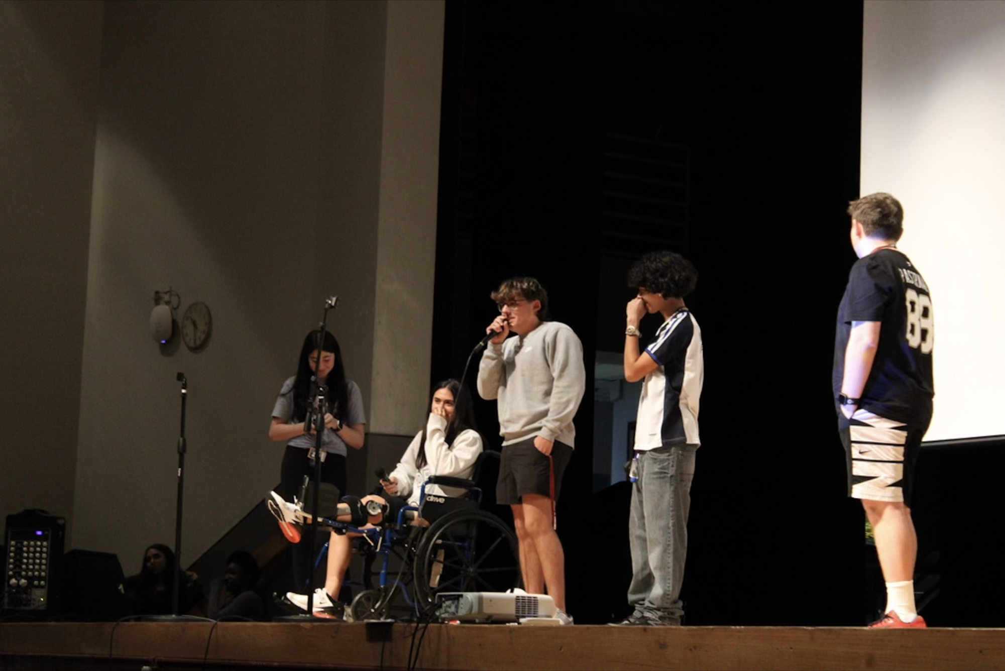 Senior Joey Chiera tells a joke on the auditorium stage at the Laughter Heals at MSD assembly. The assembly, led by project directors Macy Meis and Kyra Shultz, was held to inform students of the healing benefits of laughter and to promote the club.