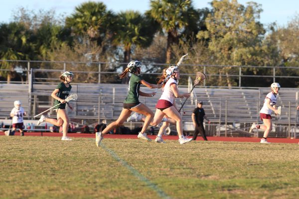 Attacker Kaitlyn Irwin (3) rushes upfield to advance on the Pine Crest Panthers goal. Irwin scored five goals to contribute to the 13-8 win over the Panthers.