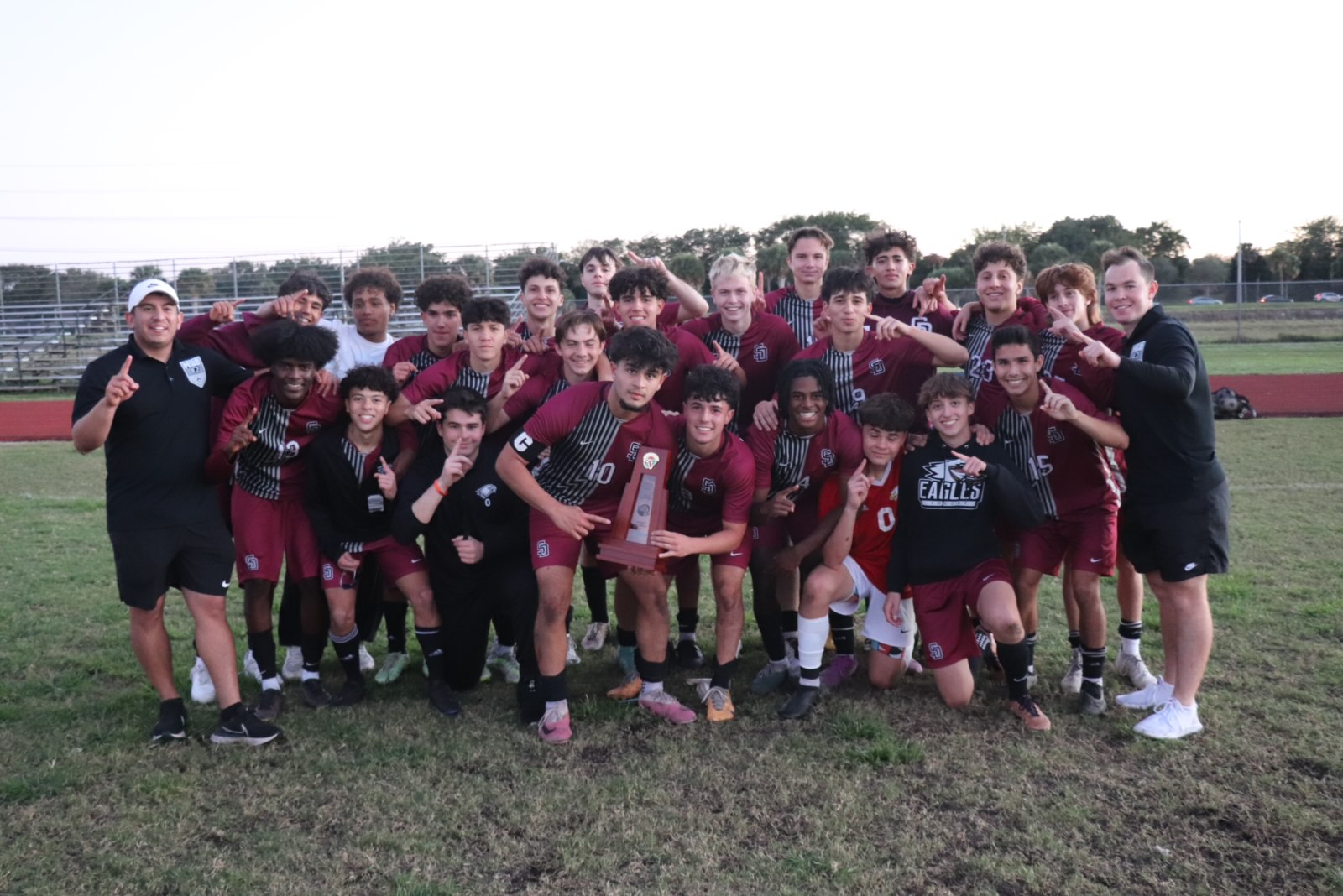 The Marjory Stoneman Douglas High School Eagles varsity mens soccer team celebrates their victory against Monarch High School on Monday, Jan. 29. The Eagles went into overtime; the final score was 2-0.