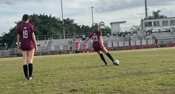 Kicking for glory. Centerback Jackie DeStefano practices her long ball before the start of the semi-finals against Coral Reef High School. The MSD womens varsity soccer team brought home the victory for districts and look to continue their winning streak in the regional semifinals.