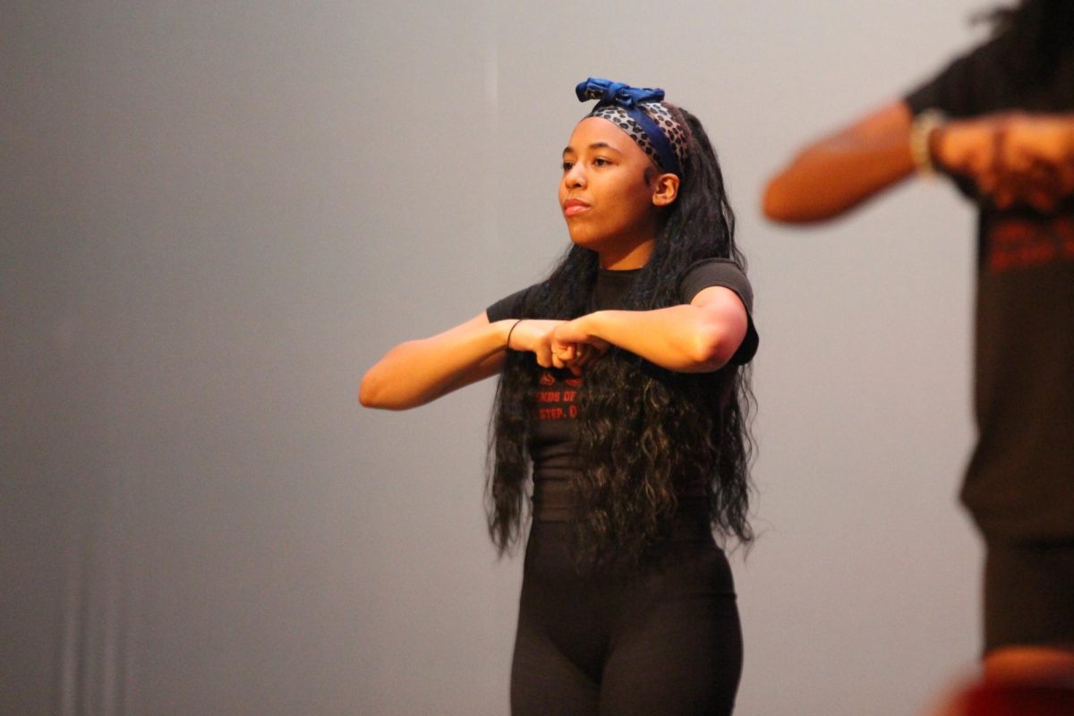 Senior Dana Wilson performs with the MSDs Legends of Destiny Step Team on Jan. 25 for the Mr. Douglas Pageant Show. LOD Step Team, along with LED Dance Club and a few students performing a lip-sync battle, were there as a short break for the audience at Mr. Douglas.